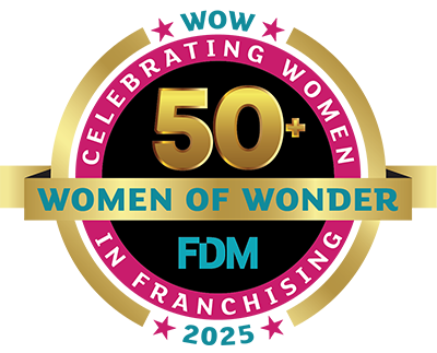 A circular gold, pink, and teal badge reads: Celebrating Women 50+ Women of Wonder FDM In Franchising WOW 2025 with stars around the edges. A circular gold, pink, and teal badge reads: Celebrating Women 50+ Women of Wonder FDM In Franchising WOW 2025 with stars around the edges.