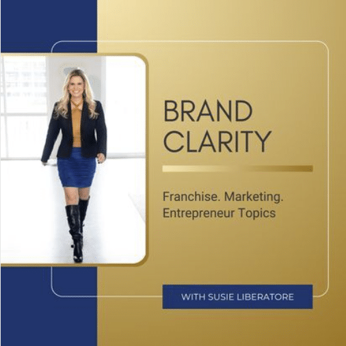 A woman in a blazer, skirt, and boots stands confidently in a bright room. Text reads: Brand Clarity. Franchise. Marketing. Entrepreneur Topics. With Susie Liberatore on a blue and gold background.